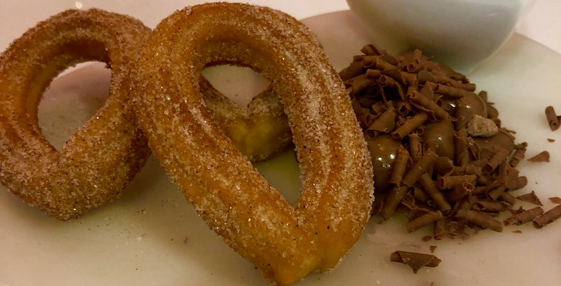 Warm Churros with melted chocolate