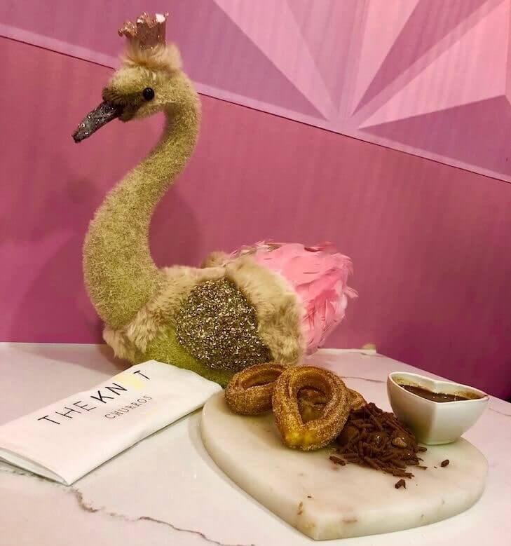 Hot Churros displayed on table with swan